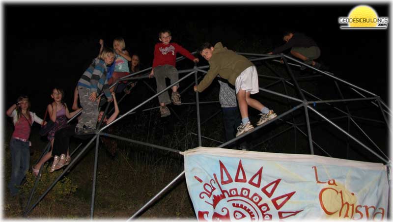 Kids climbing on one of our geodesic domes